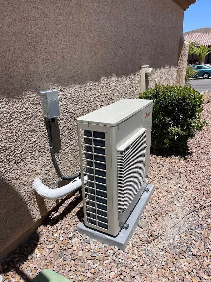 Residential air conditioning condenser unit in Hilo